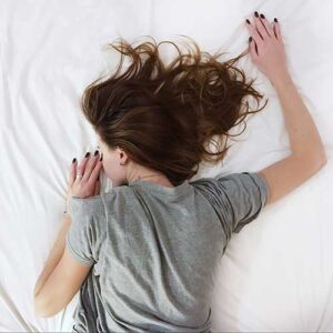 Diving in to fresh linen sheets washed with Biocels Commercial Laundry Liquid